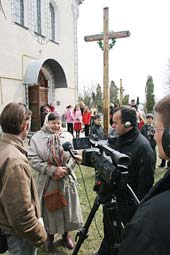 An interview being recorded as the congregation leaves Mass.  Guillaume Ribot